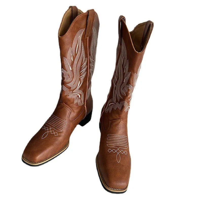 Brown women's embroidered leather Martin boots with a low square heel and mid-calf design.