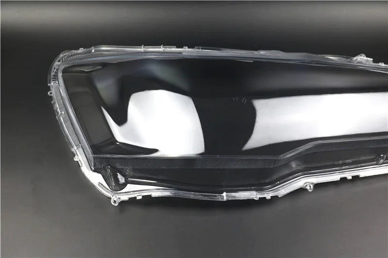 Transparent plastic headlight housing cover for car lighting replacement measuring 50x30x20mm