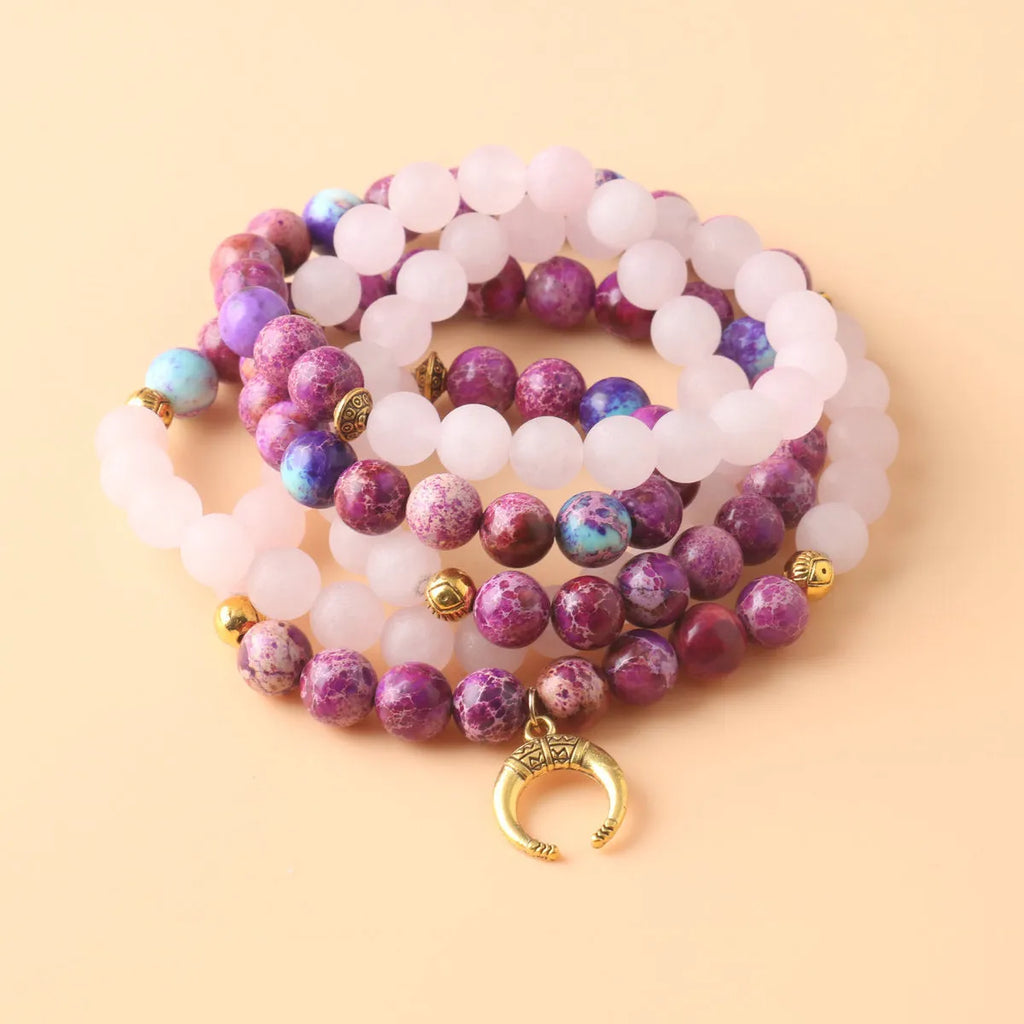 Pink crystal Emperor Stone beads pendant necklace on model, showing round beads and adjustable chain