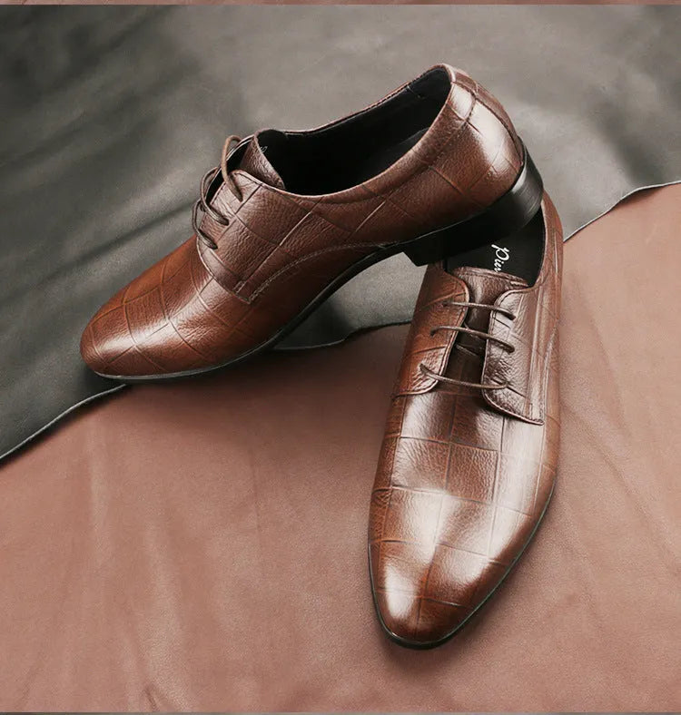 Men's black leather derby shoes with pointed toe, checkered sewing detail, and a rubber sole.