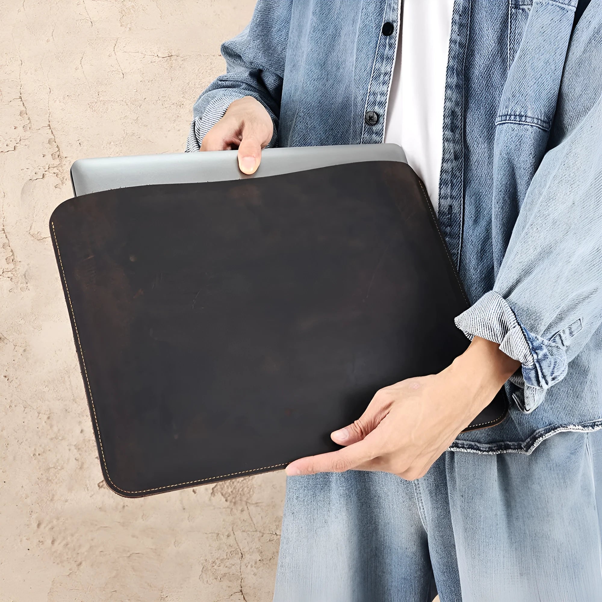 Brown genuine leather horizontal computer liner bag with cowhide lining showing interior compartments