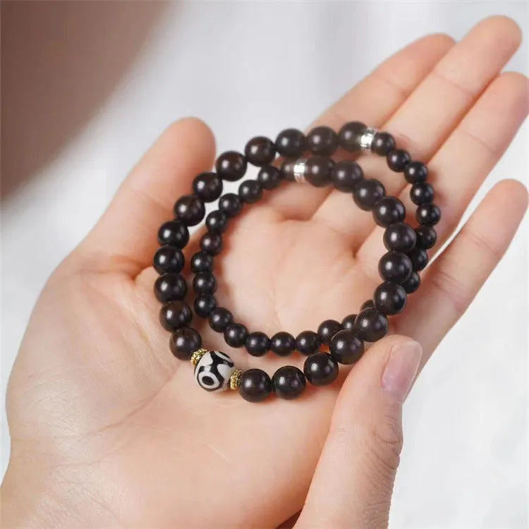 Ebony wood bracelet with 8mm beads and Tibetan two-circle pattern