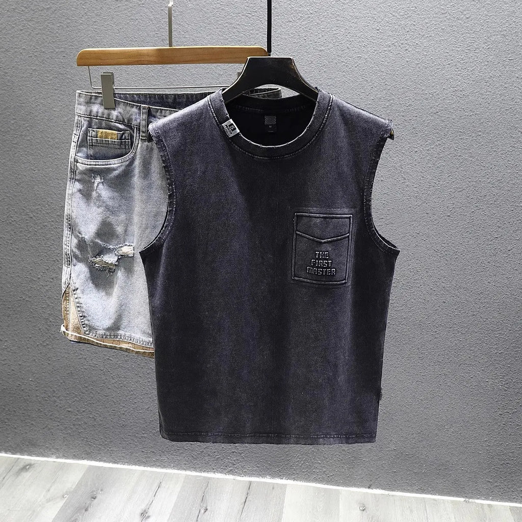Loose fit solid colour cotton sleeveless t-shirt on a hanger, shown in white.