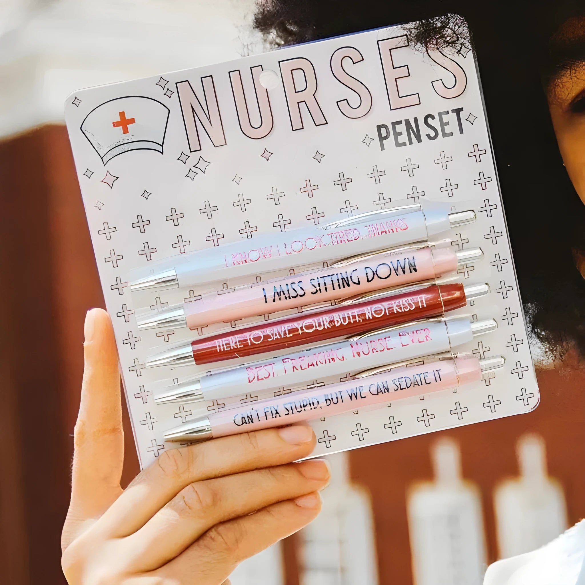 Set of five white nurse theme ballpoint pens with retractable tips.
