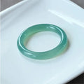Natural agate wide tyre bead bracelet shown in multiple colour options including pink, blue, and landscape agate.