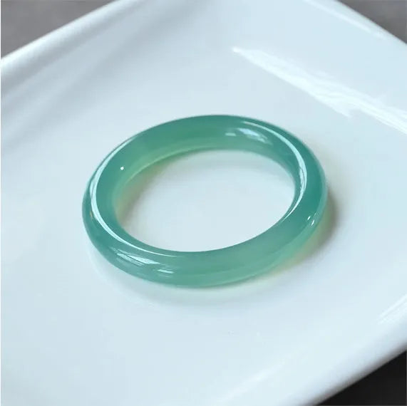 Natural agate wide tyre bead bracelet shown in multiple colour options including pink, blue, and landscape agate.