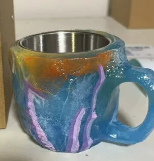 Resin mineral crystal coffee mug with handle in purple colour, showing 3D texture.