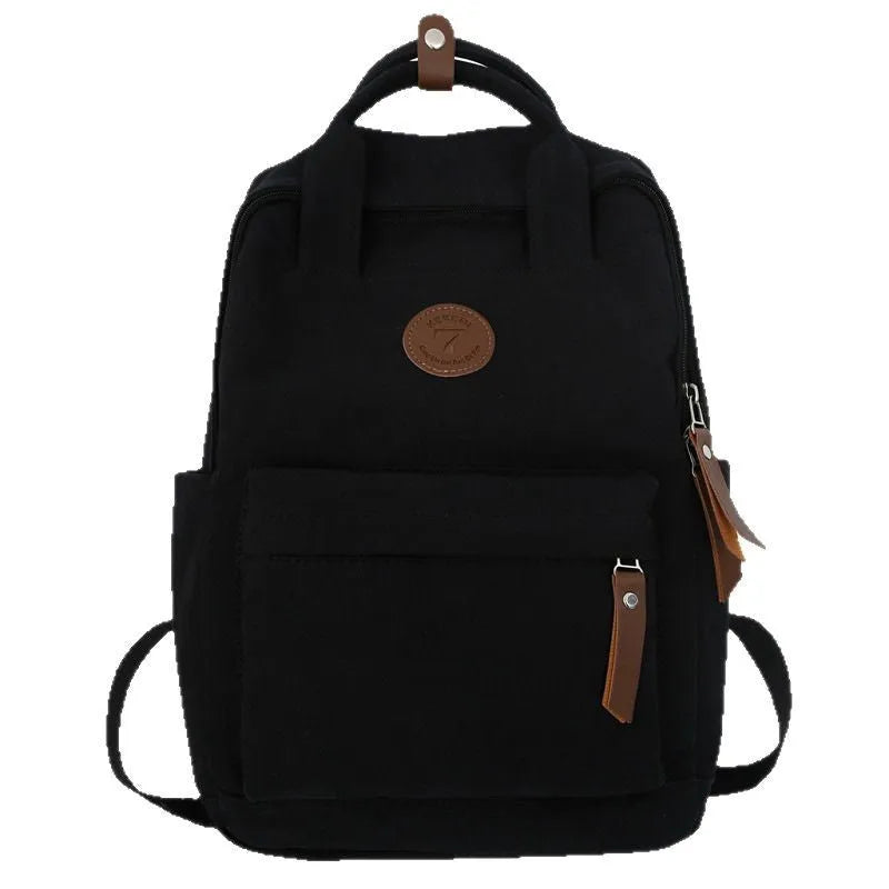 Black Oxford cloth backpack with curved shoulder straps and retro sewing thread detailing