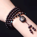 Zambia rosewood Buddha beads bracelet with flat lotus pendant showing 108 beads