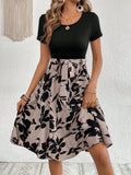 Women's casual dress with plant and flower printing pattern, lace-up details, and shoulder straps