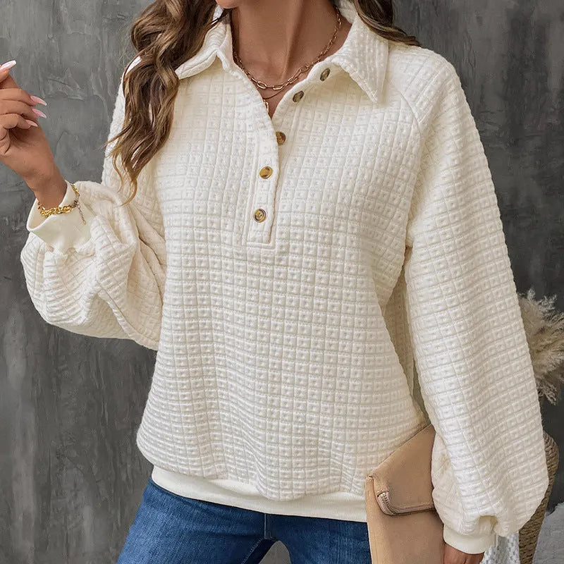 Women's beige polo collar pullover sweater with long sleeves, laid flat.