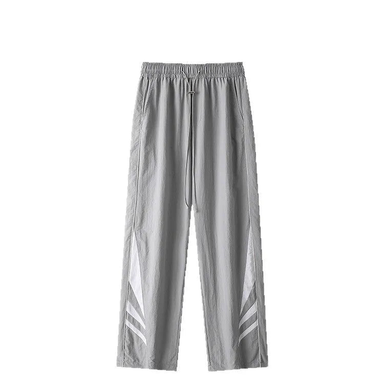 Men's straight-leg loose fit sports trousers in grey fabric with an elasticated waistband.