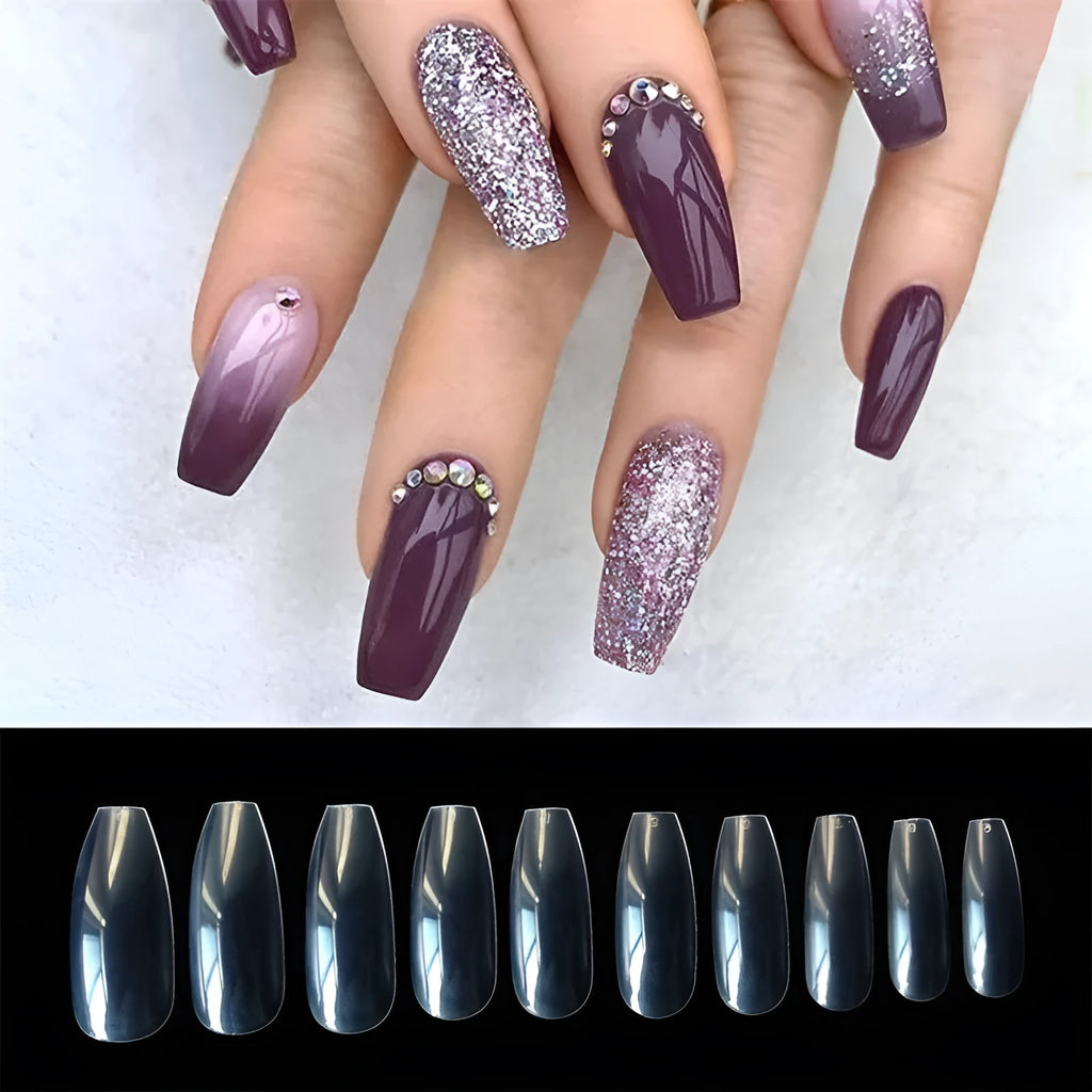 500 clear and natural ABS acrylic false nails in 10 sizes spread on a table