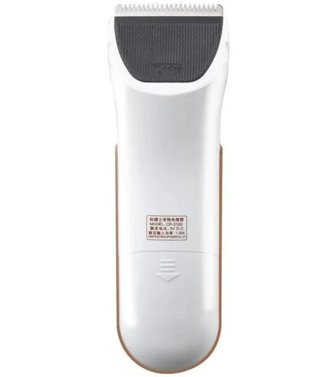 White electric pet hair clipper with ceramic blade on a table