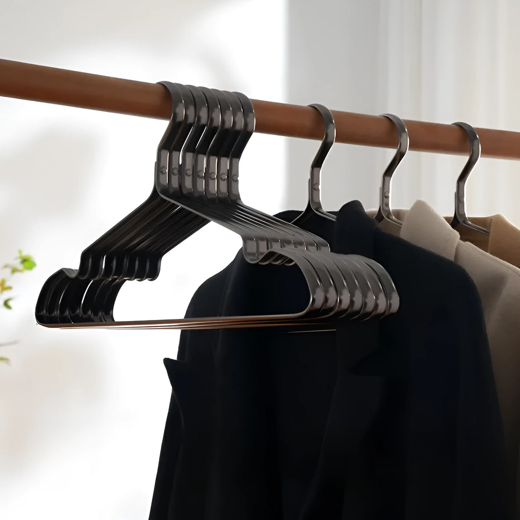 Elegant black non-slip anti-rust clothes hanger with modern minimalist design for trousers and ties.