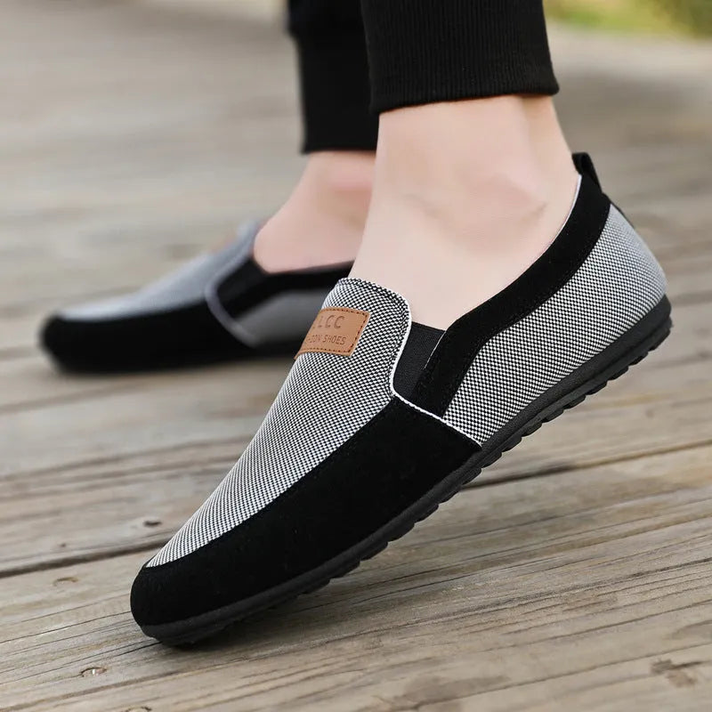 Men's grey canvas board shoes with round toe and sewing thread detail on cotton-lined upper