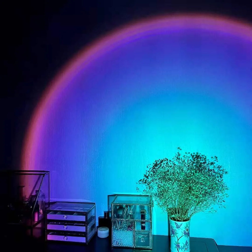 Rechargeable sunset projection lamp showing rainbow and red light patterns