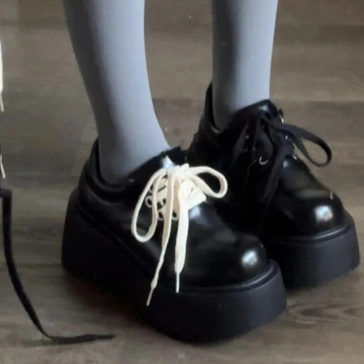 Black women's lace-up shoes with English muffin heels and round toe