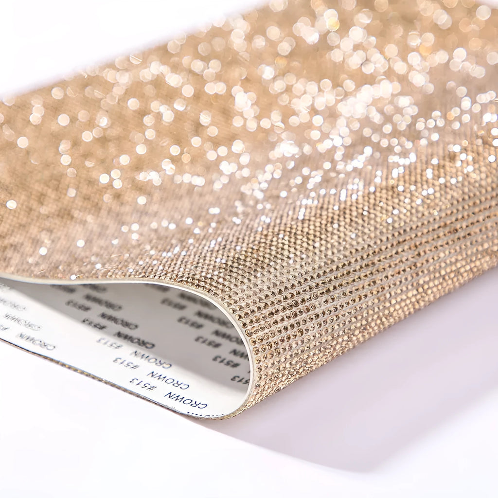 Rhinestone sticker sheet in eight eyes pattern showing electroplated crystals on adhesive backing