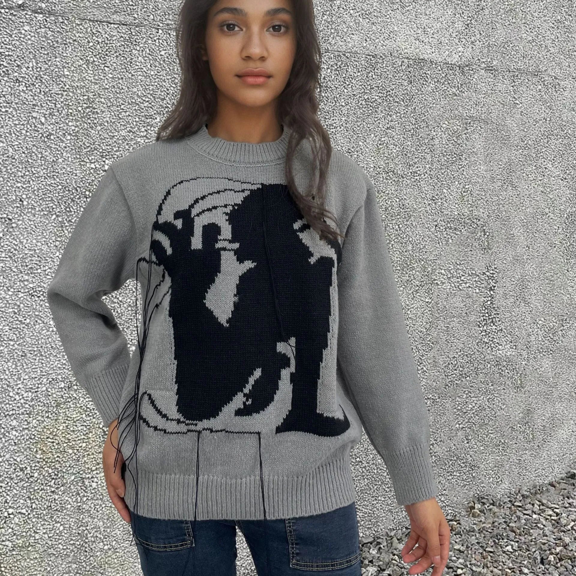 Women's grey alpaca wool sweater with tassel detailing and abstract pattern