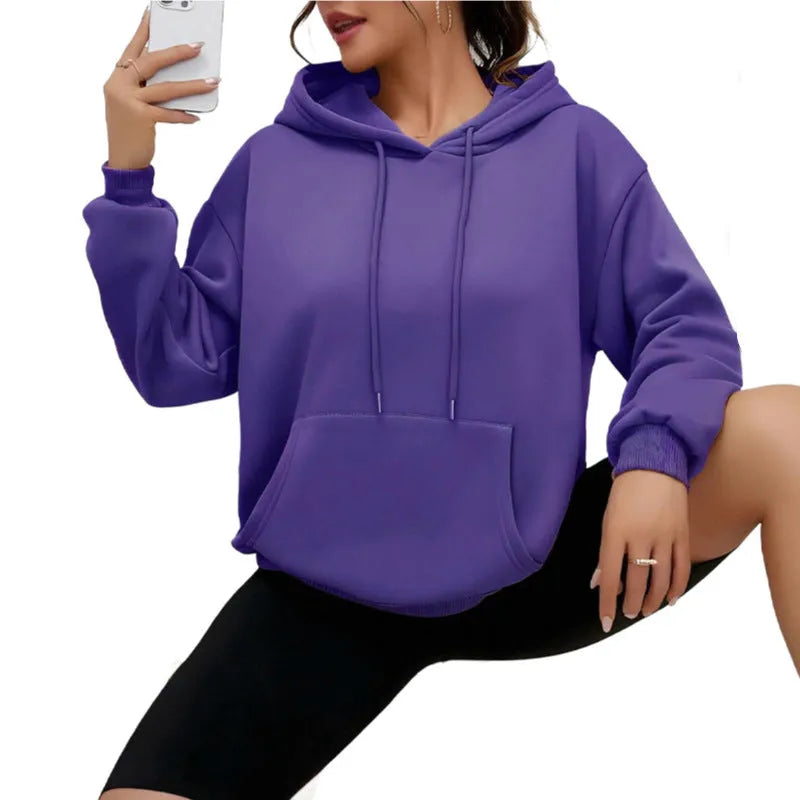 Women's loose drawstring pocket sweatshirt in polyester fabric showing side pockets and long sleeves