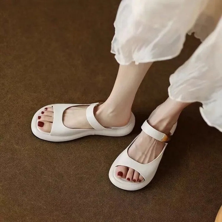 Apricot leather peep toe platform sandals with rubber soles shown from side view