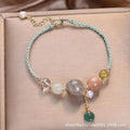 Hand-woven crystal and sequin bracelet with metal buckle clasp in red, blue, or green.