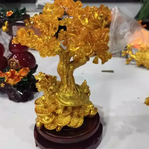 Citrine coloured resin turtle money tree Feng Shui ornament measuring 18 by 11 by 23 centimetres