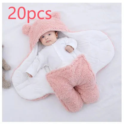 Quilted baby sleeping bag wrapper in light blue, showing size and cotton blend fabric texture.