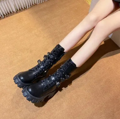 Black women's mid-calf knight boots with metal buckle straps and a side zipper on a round toe.