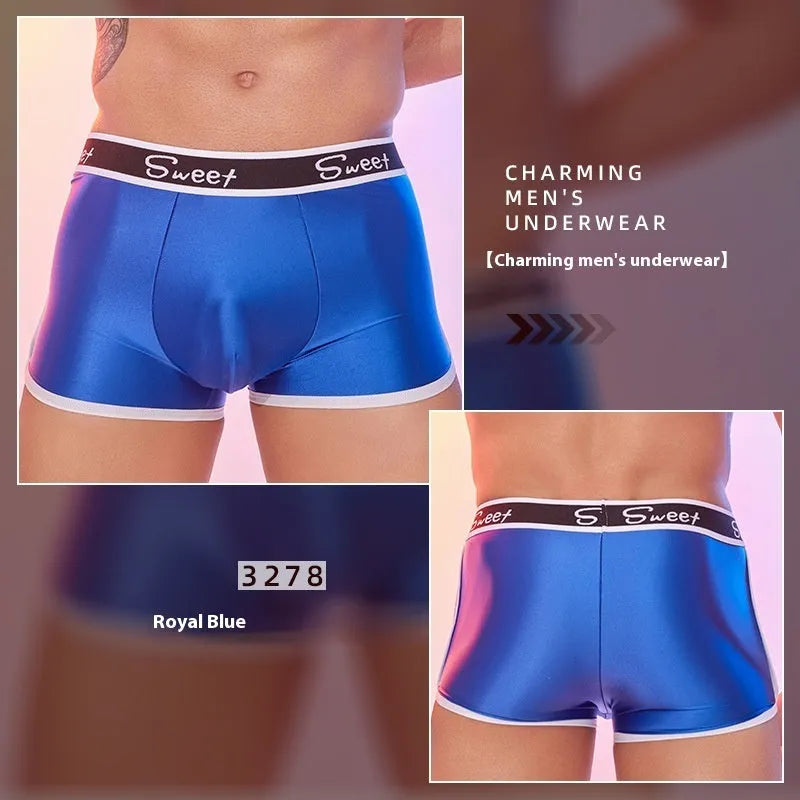 Men's silky nylon boxers in black, white, and sapphire blue colours on a white background.