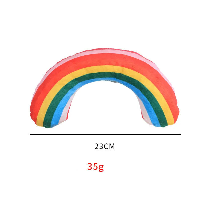 Green, rainbow, and yellow striped cat pillow and noise toy set on a white background