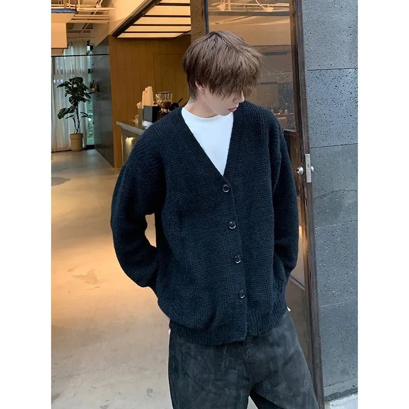 Men's loose fit V-neck cardigan jumper in a solid colour cotton blend fabric.