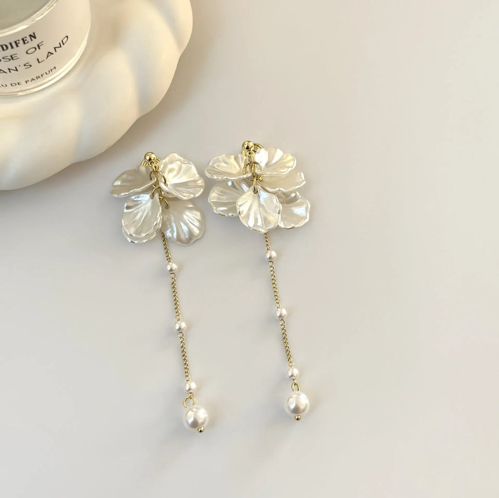 Women's acrylic shell pearl tassel earrings with multiple clip options showing 8.8cm length