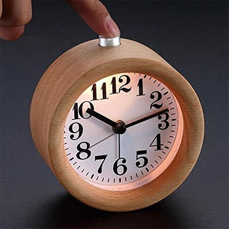 Solid beech wood silent snooze alarm clock showing wooden case, glass mirror face, and 9.5cm diameter