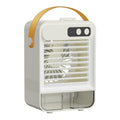 Dark green and ivory white coloured small USB desktop fan with 5 blades on a desk.