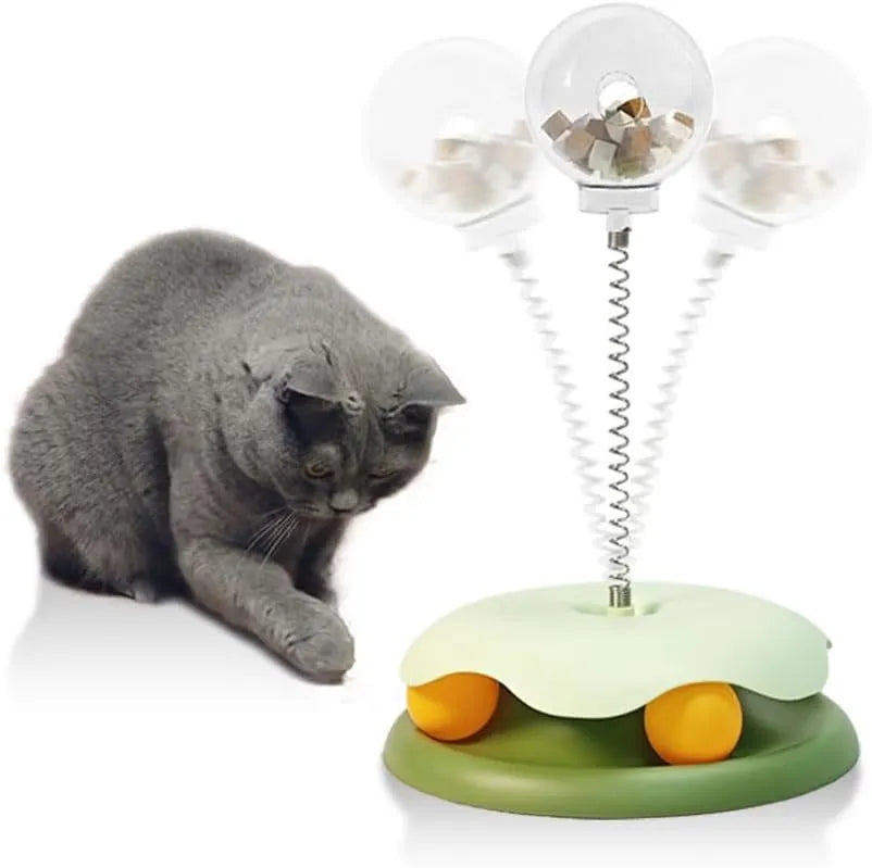 Blue or green PP plastic cat treat dispenser toy with track ball, showing slow feeder design and rounded shape.