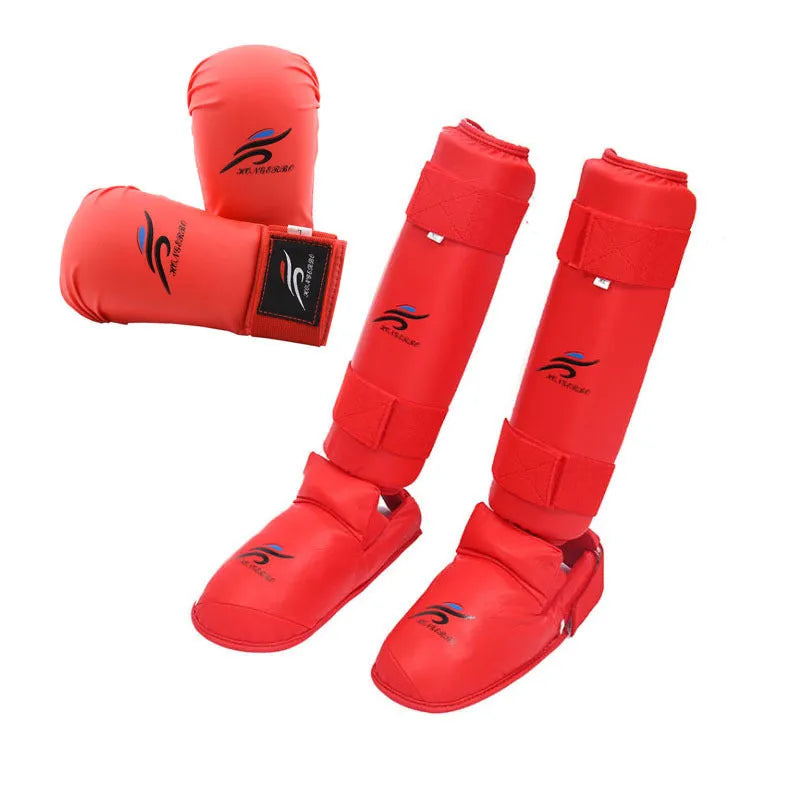 Red and blue karate protective gear set showing leg guards, helmet, and boxing gloves on a white background.