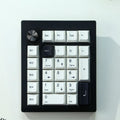 Black and white wireless mechanical numeric keyboard with Bluetooth connectivity