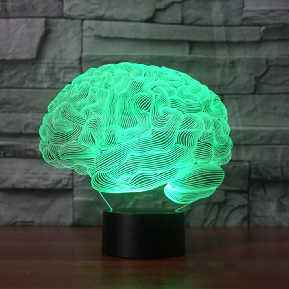 3D acrylic illusion desk lamp with colour-changing LEDs and a black ABS base on a wooden surface.