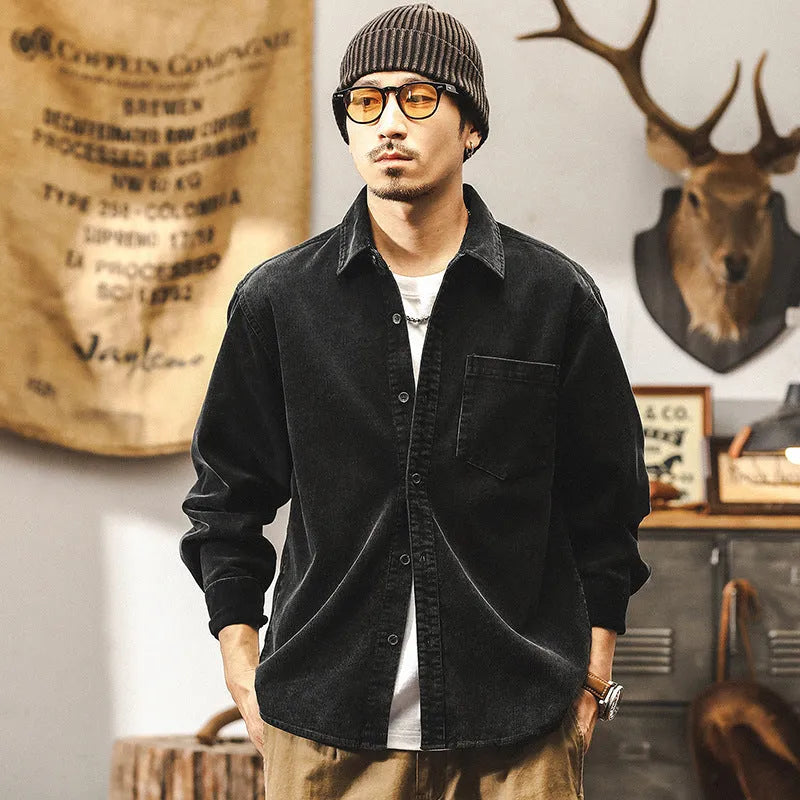 Men's black corduroy casual shirt jacket with long sleeves and a loose fit.