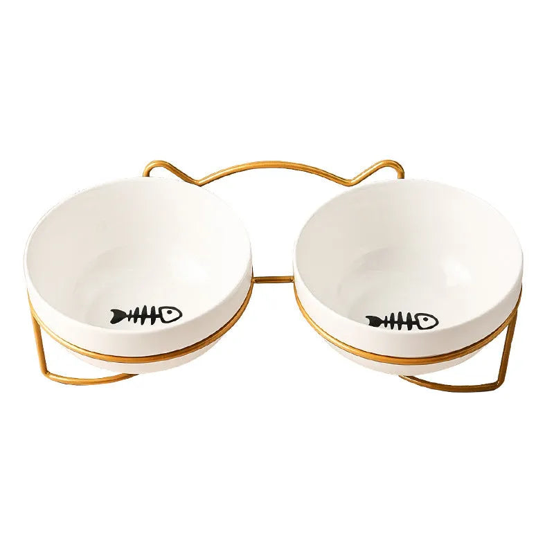 White ceramic cat bowl with decorative iron frame in cat footprints pattern