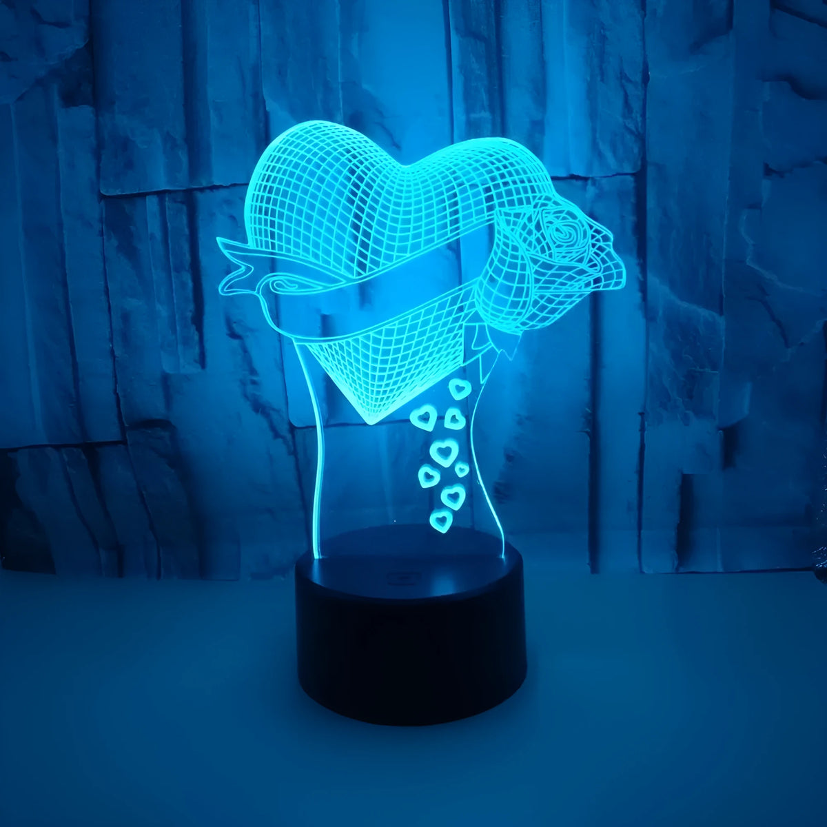 3D night light with acrylic board and black ABS base, showing seven colours and USB cable