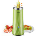 Compact beige and green automatic breakfast machine on kitchen countertop