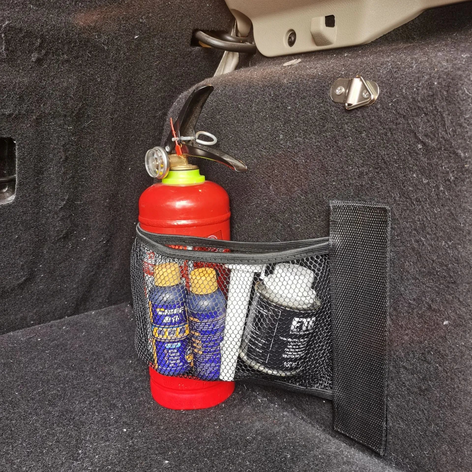 Grey elastic polyester car trunk storage net organiser in two size options.