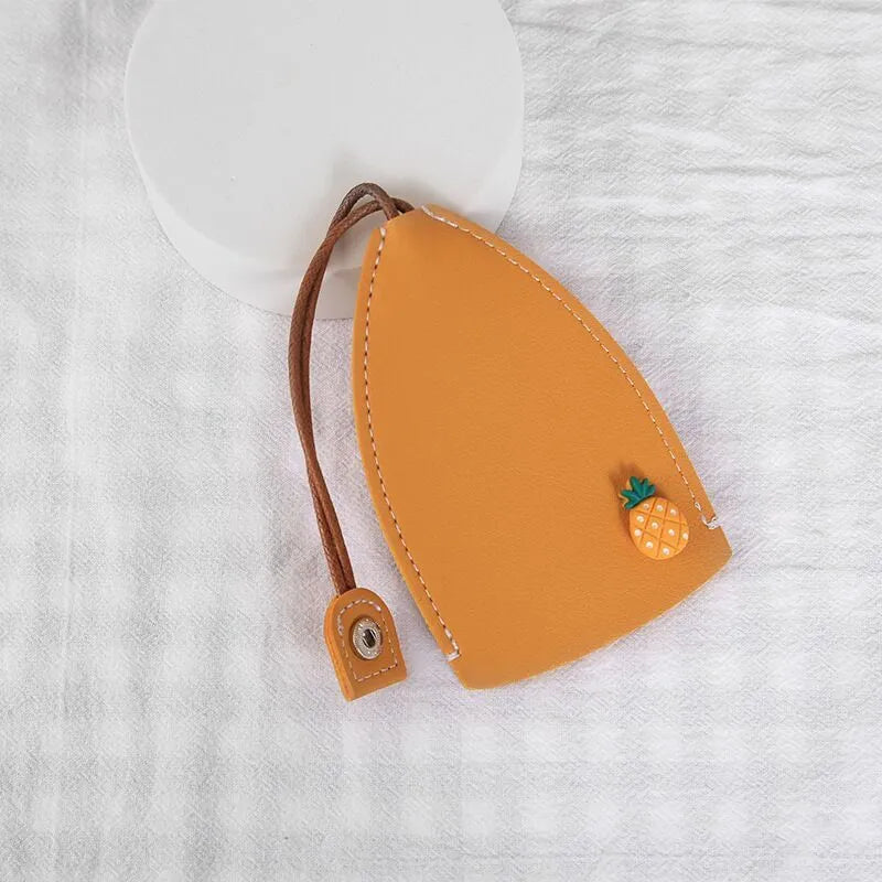 Cartoon PU leather pull-out car key case measuring 14 x 7.5cm with colourful designs