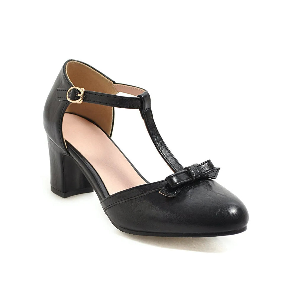 Women's apricot coloured sandals with a chunky 6.5cm heel, bow tie decoration, and a single buckle strap.