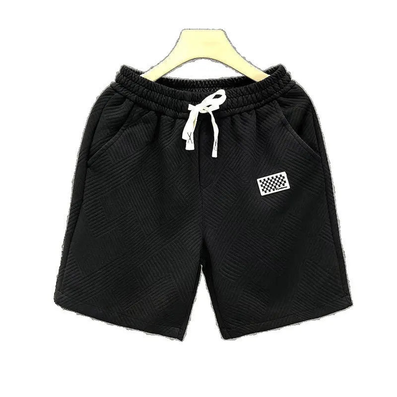 A pair of solid-colour casual sports shorts made from polyester, shown in white, suitable for beach and outdoor activities.