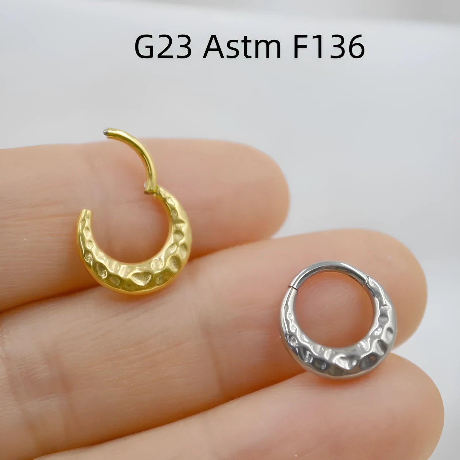 Titanium alloy concave-convex nose ring with carving detail in gold or silver colour.