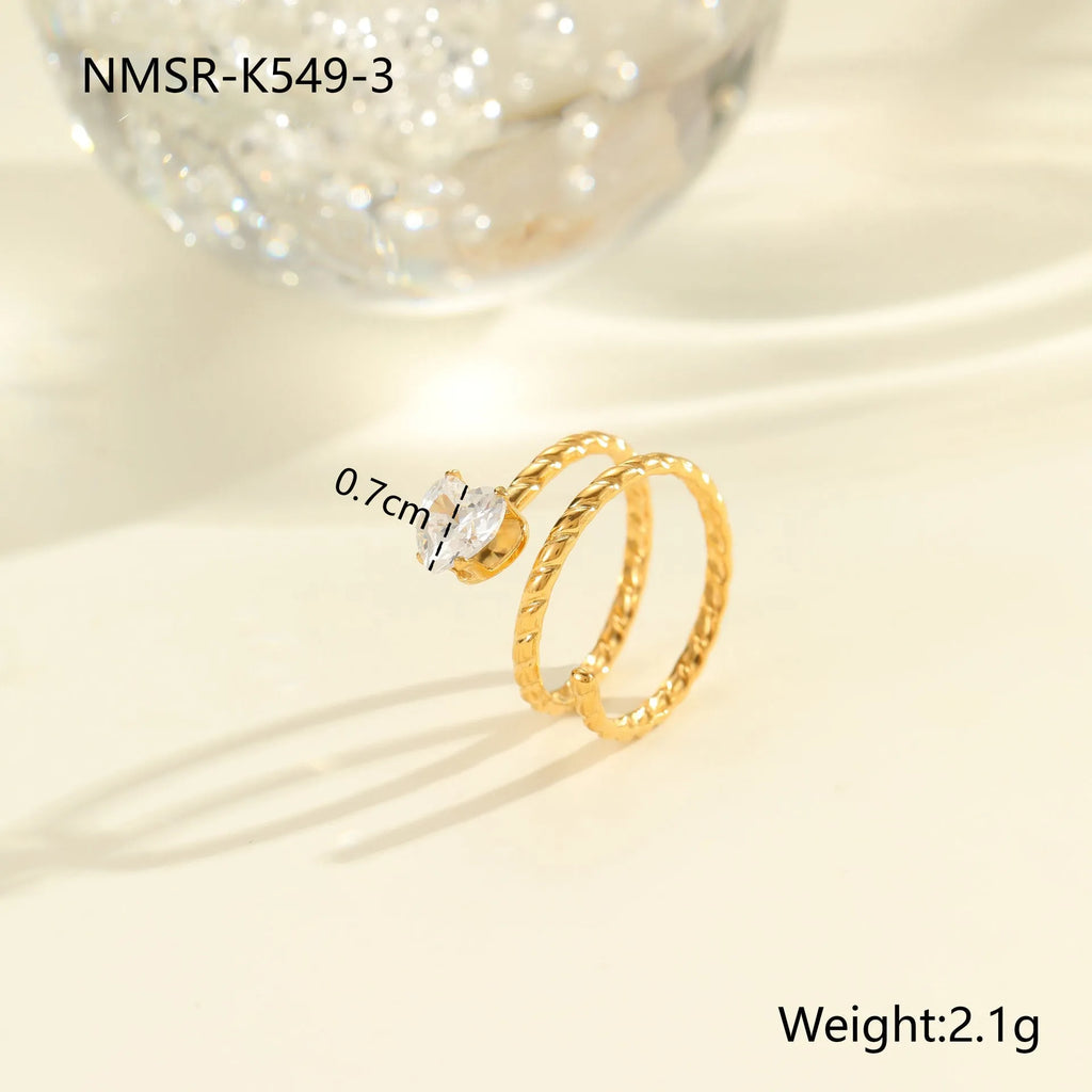 Gold electroplated stainless steel ring with geometric heart shape and inlaid zircon stones, open mouth adjustable design.